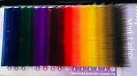 a set of different colored feathers in a book