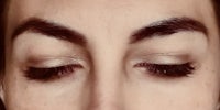 a close up of a woman's eyes