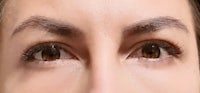 a close up of a woman's eyes